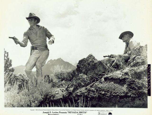 Jonas Cord (played by Brian Keith) 
teaches Max (McQueen) how to shoot.